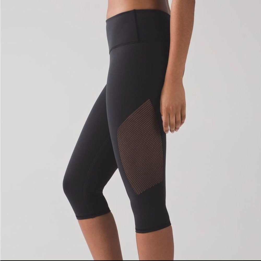 Lululemon Stylish Black Cropped Leggings with Mesh Detail.